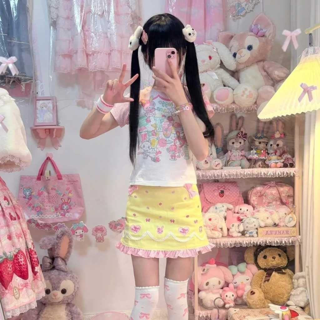 Playful pastel kawaii skirt with sunny smile faces and animal tail accents