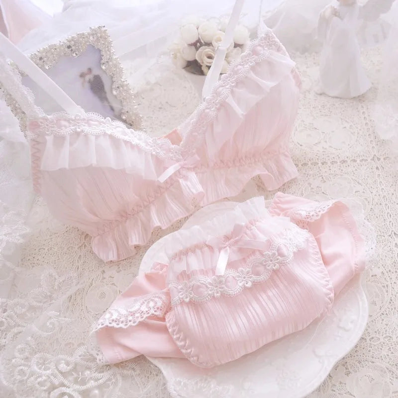 Pink pastel Lolita lingerie set with frilly bow bra and matching low-waist panties in soft chiffon and cotton lining