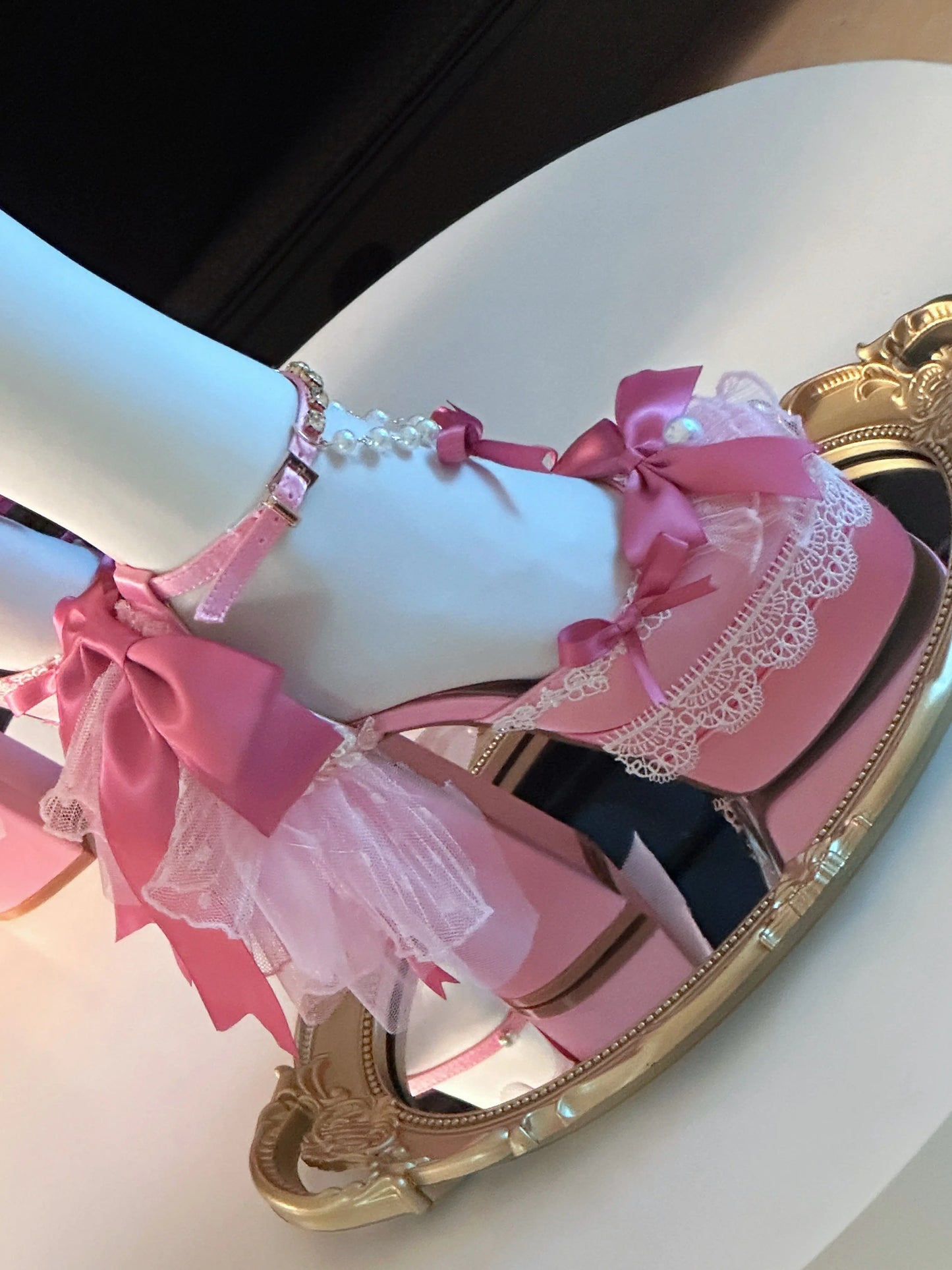Dreamy pastel pink Lolita Bombshell Heels with bows and pearl details for kawaii aesthetics