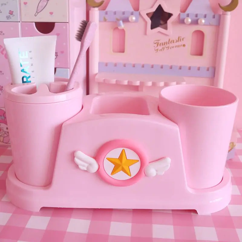 Pastel pink magical bathroom cups with star and wings motif, perfect for toothbrushes, mouthwash, or small trinkets π