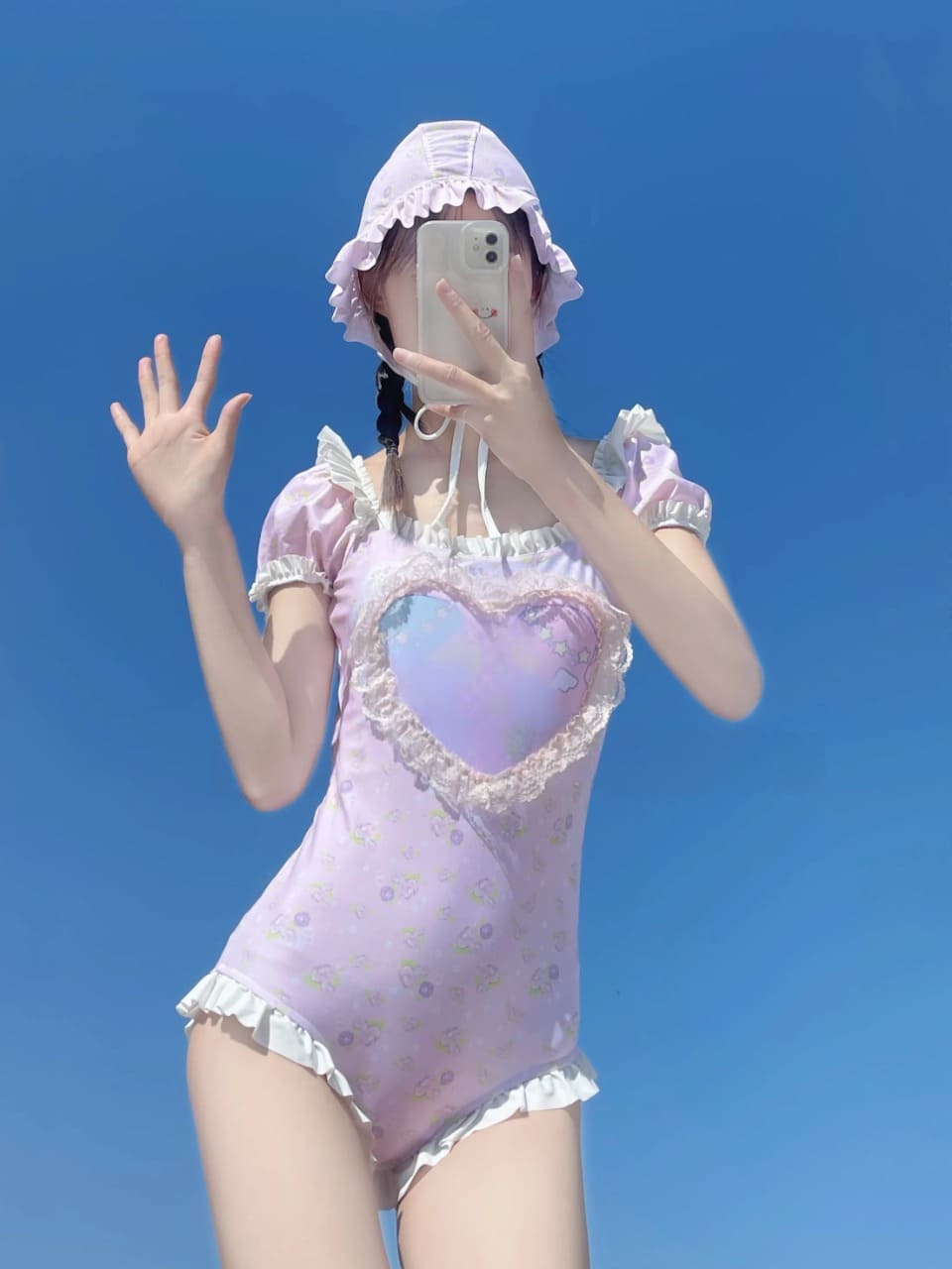 Pastel pink onesie combining kawaii softcore style and ddlg fashion with cherub heart design
