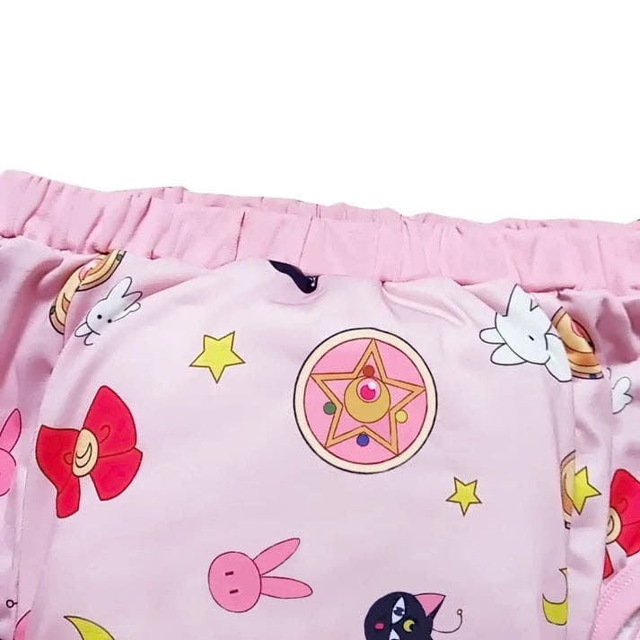 Celestial-themed training pants in pink with waterproof layer, plush padding, and gentle waistband for littles