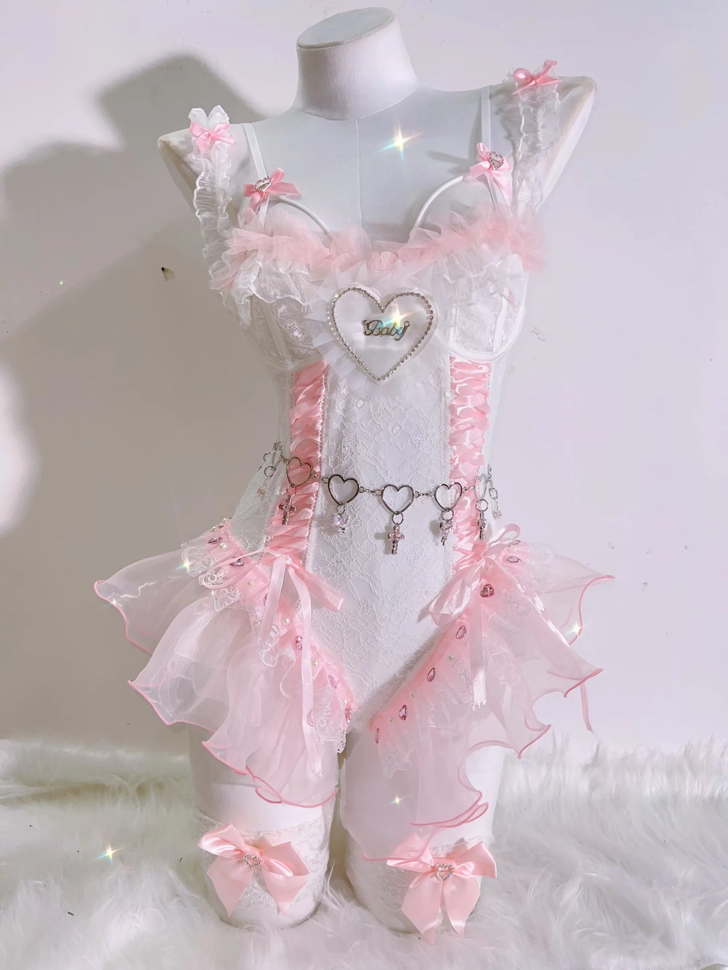Soft luxe pink ballerina corset set with satin finish, heart details, and “baby” text, perfect for playful babygirl energy