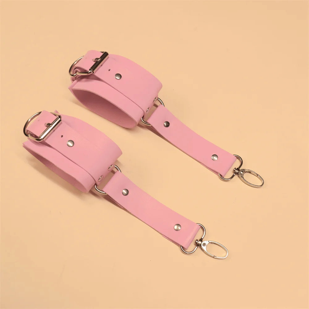 Playful pink wrist-to-thigh harness made from soft faux leather, perfect for roleplay and sexy aesthetics