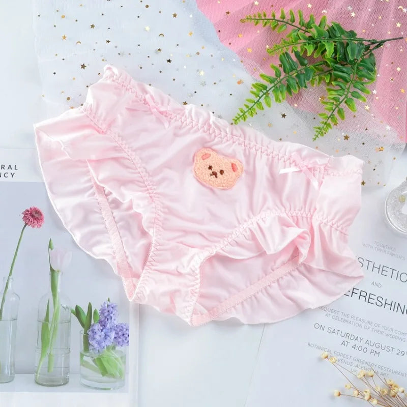 Soft pink teddy ruffle panties with stretchy waistband and cute teddy bear print for everyday comfort