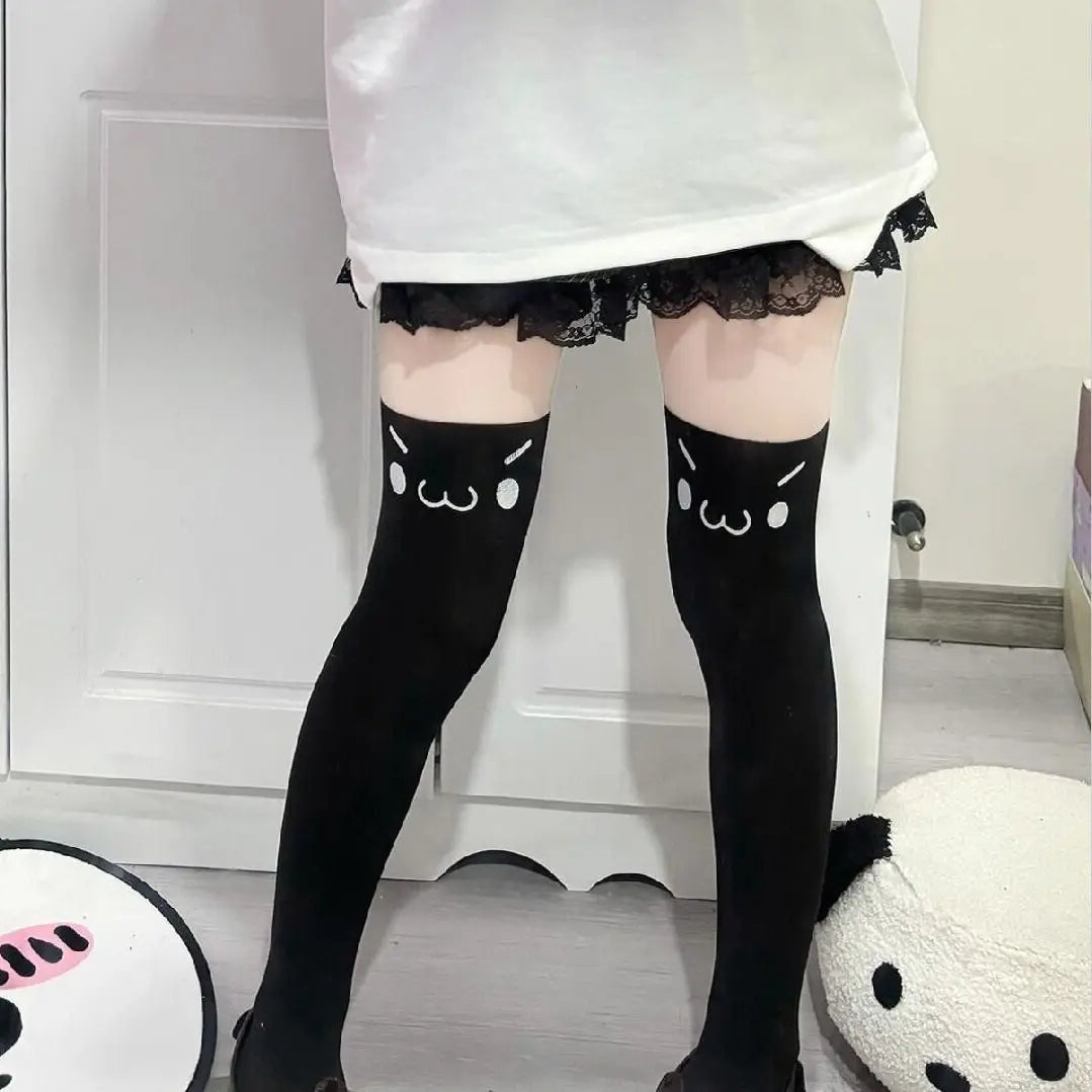 Adorable kawaii face print stockings with stretchy fabric for comfy cosplay, cutecore, and babycore looks.