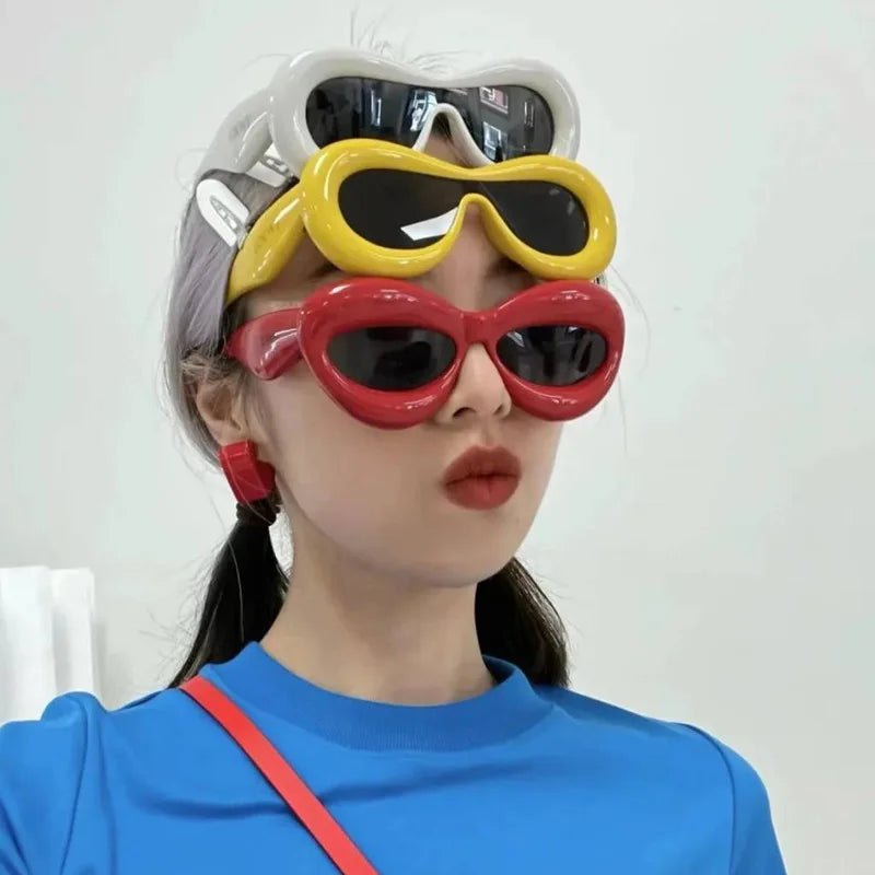 Model wearing 3 pairs of Pop Art Icon Sunglasses, playful and trendy DDLG ABDL vibes
