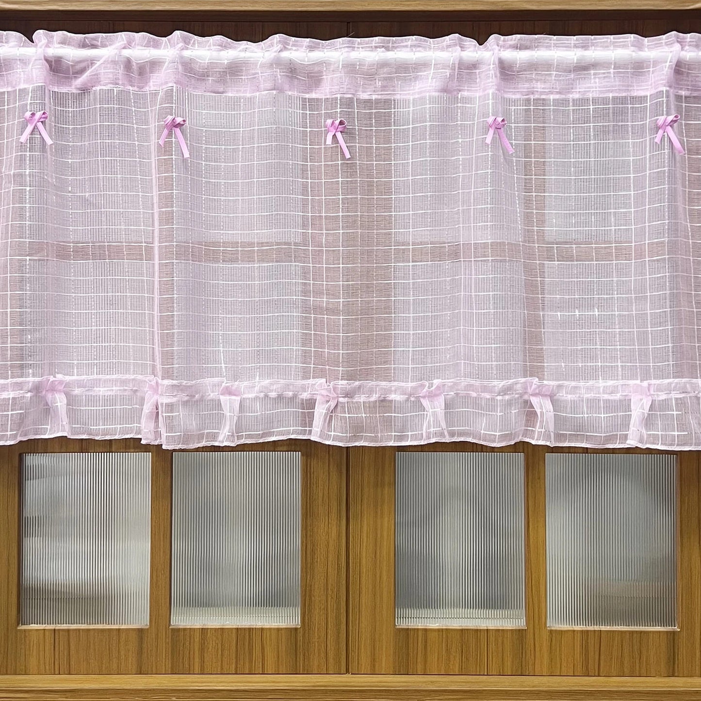 Princess-inspired pink tulle curtains with dainty sheer fabric for a soft and magical room ambiance