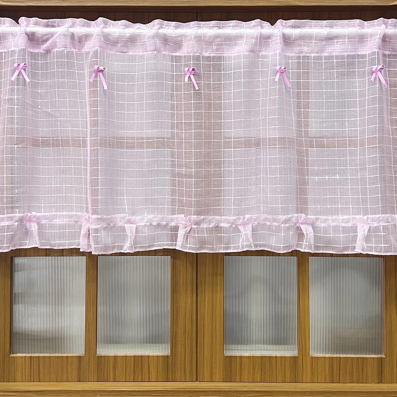 Princess-inspired pink tulle curtains with dainty sheer fabric for a soft and magical room ambiance