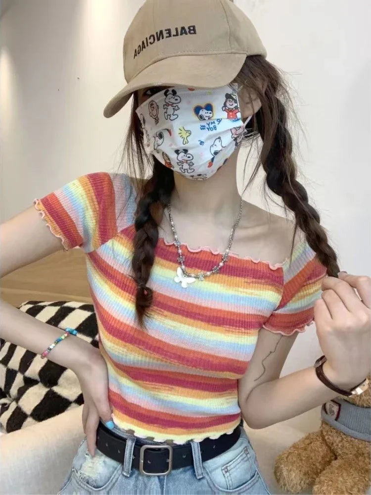 Bold rainbow off-shoulder crop top, colorful kawaii cutecore style for little space, cosplay, or playful outfit layering