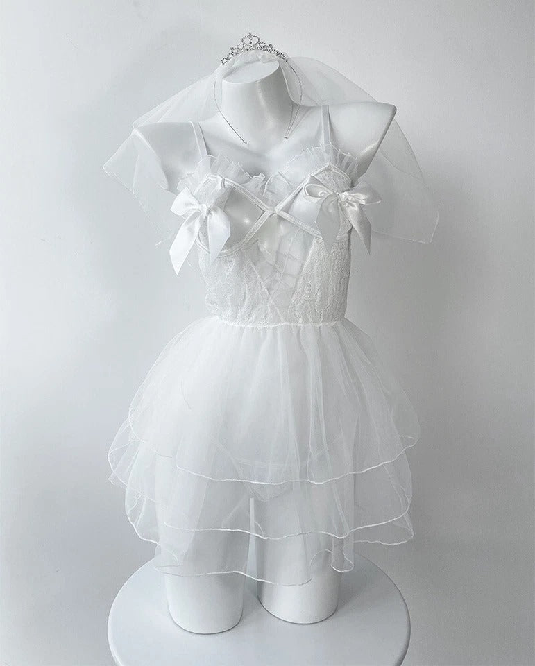 Romantic bridal babydoll lingerie set with sheer dress, matching thong, veil, and thigh-high stockings