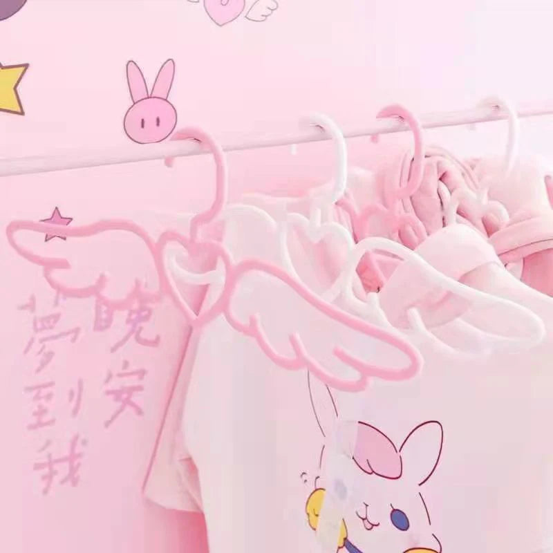 Romantic closet hanger with delicate wings and heart centerpiece for DDLG ABDL lovers