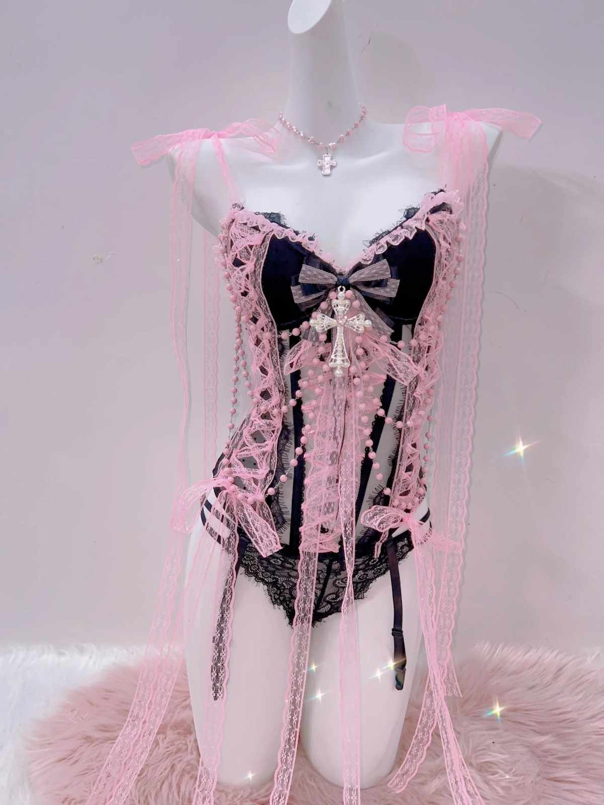 Sexy soft pink lingerie set with sheer fabric, bold cross detail, and curve-hugging comfort.