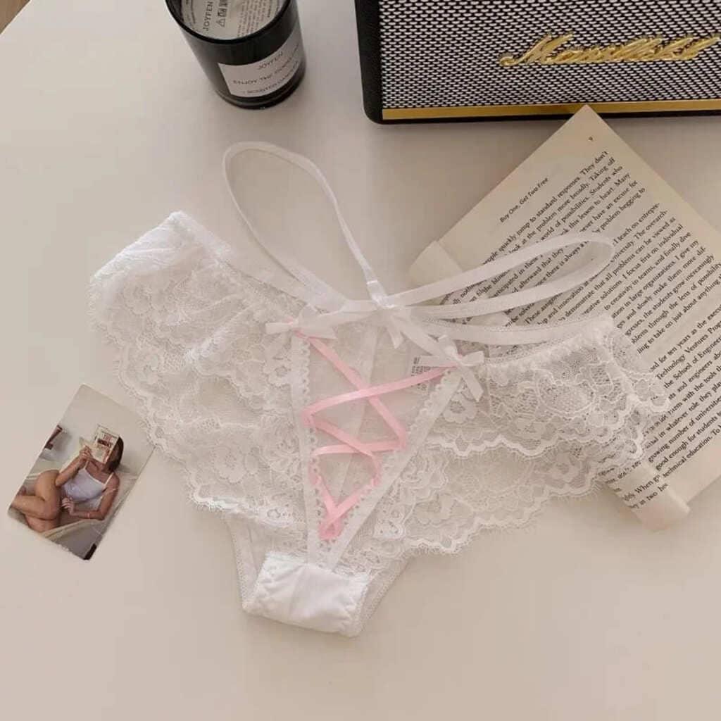 Soft white lace lingerie with sheer mesh, sweet bow detail, and hollow-out flirty design