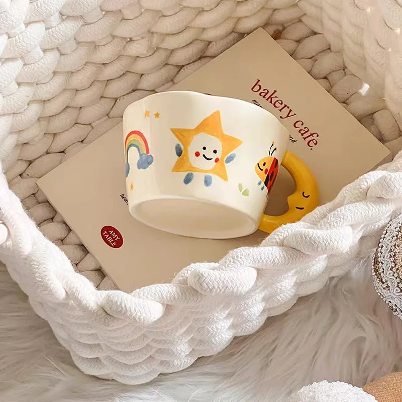 Delightful pastel ceramic mug with magical crescent handle, sun, and flower details for DDLG ABDL cuties