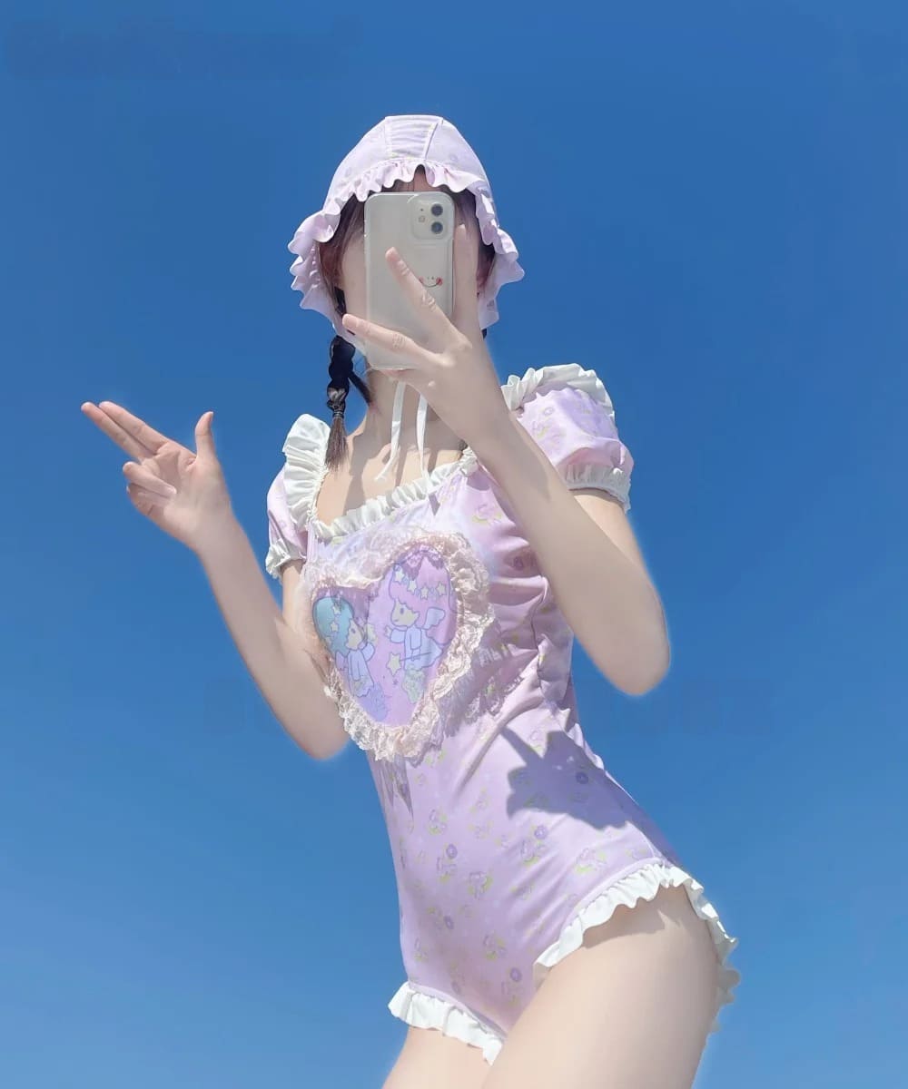 Softcore kawaii onesie featuring a cute cherub inside a sweet heart print with ruffle details