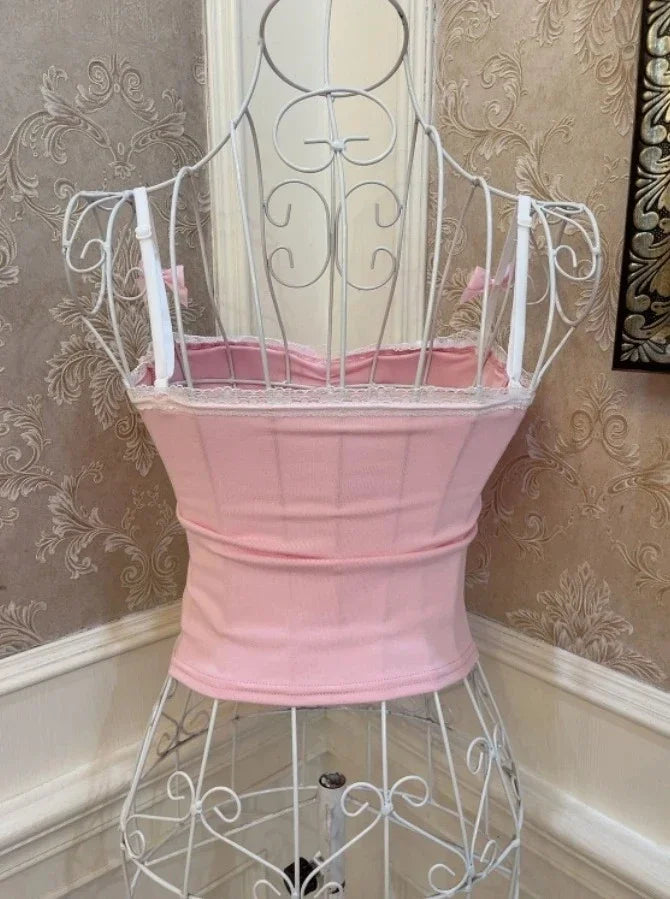 Back view of Spoiled Princess pink pearl detail tank top with delicate bows