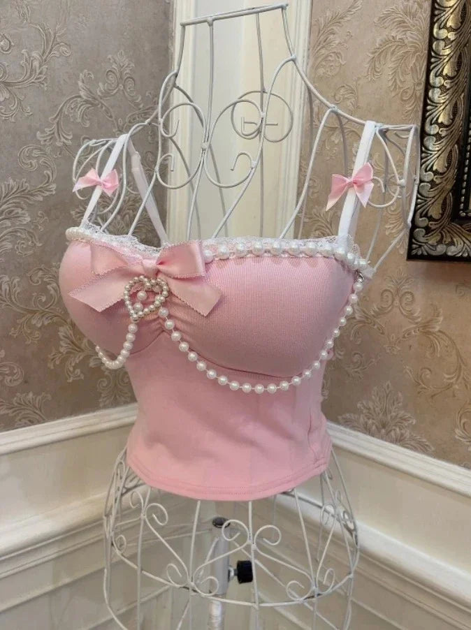 Side view of Spoiled Princess pink tank top with pearl accents and lace trim