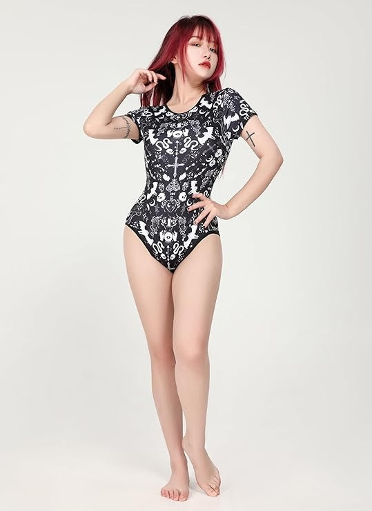 Close-up of Spooky Season Onesie, soft fabric with black and white kawaii cutecore design, flirty ABDL & DDLG Halloween accessory