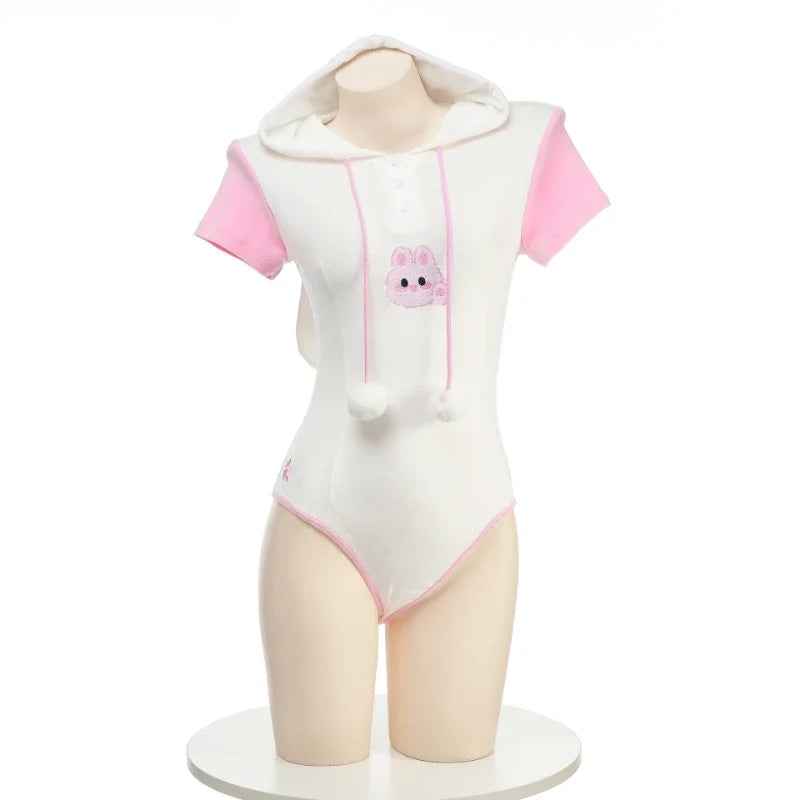 Sugar Bunny hooded onesie in pastel pink, kawaii ddlg abdl cozy loungewear with floppy ears and pompom tail