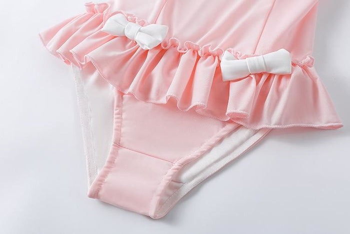 pastel pink sugar bunny snuggle onesie with frills, bows, and ears for little-space DDLG/ABDL cutecore play