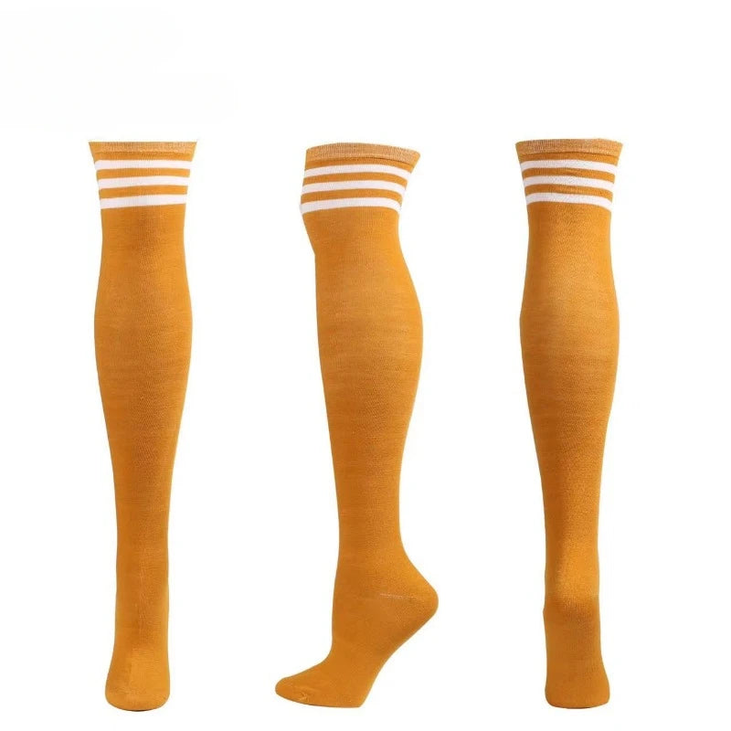 Playful orange and white striped thigh-high stockings for pastelcore and cute baddie looks