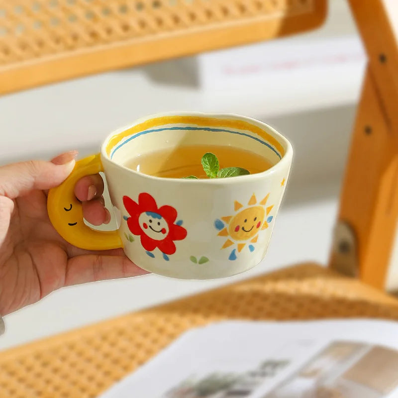 Cute ceramic mug with smiling sun, ladybug, and flower art β perfect gift for kawaii, ABDL, and babycore babes