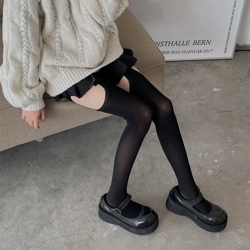 Black ruffle-trimmed thigh-high stockings with peekaboo cut-outs, a sexy and cutecore staple for littlespace.