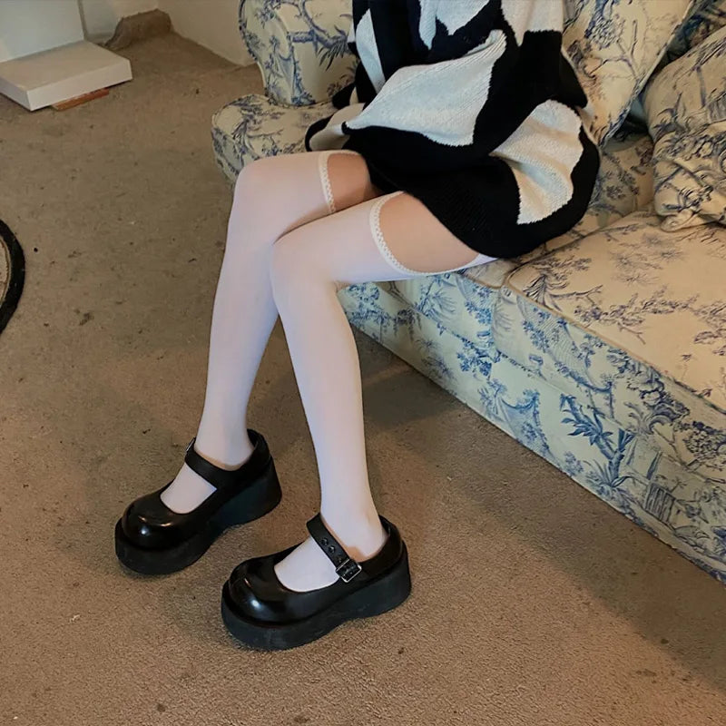 White thigh-highs with flirty ruffle trims and cut-out details, made for cute baddies and playful vibes.
