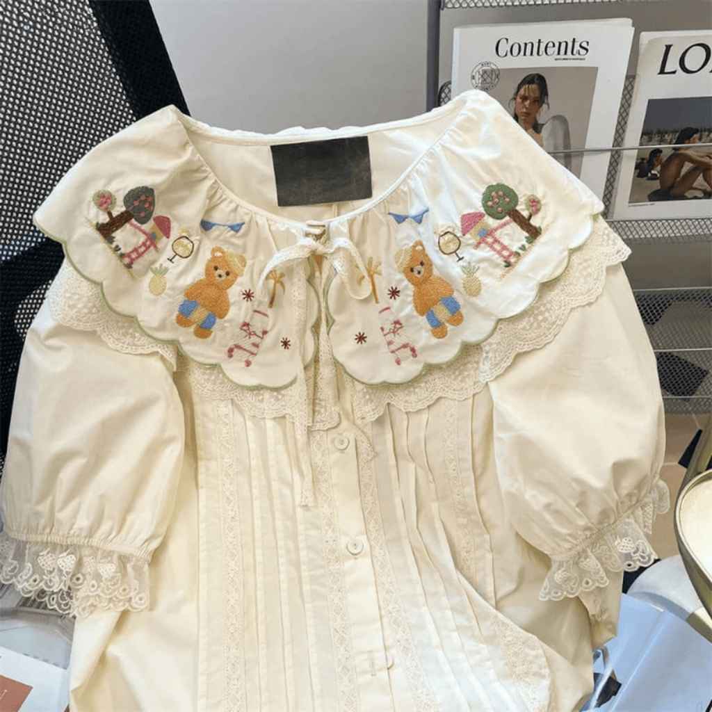 Lolita blouse with teddy bear print, perfect for layering or wearing as a cute kawaii top