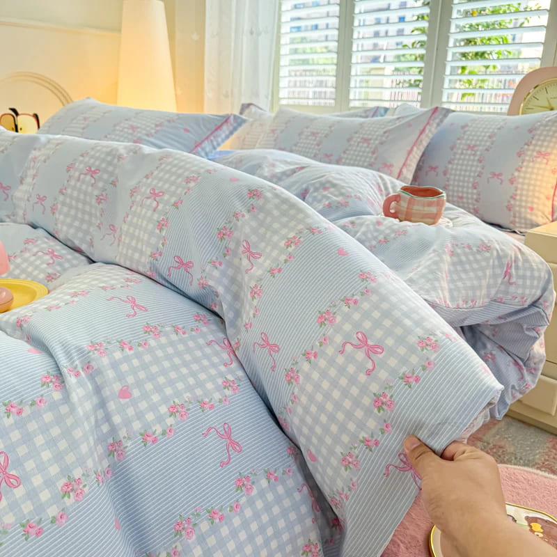 Blue plaid Victorian bedding set with subtle stripes and bow accents for pastel vintage and kawaii style bedrooms