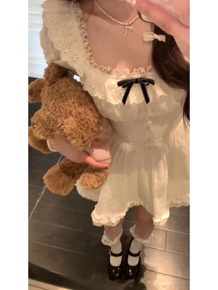 White kawaii mini dress with frilly details and black ribbon, perfect for DDLG, ABDL, cutecore outfits
