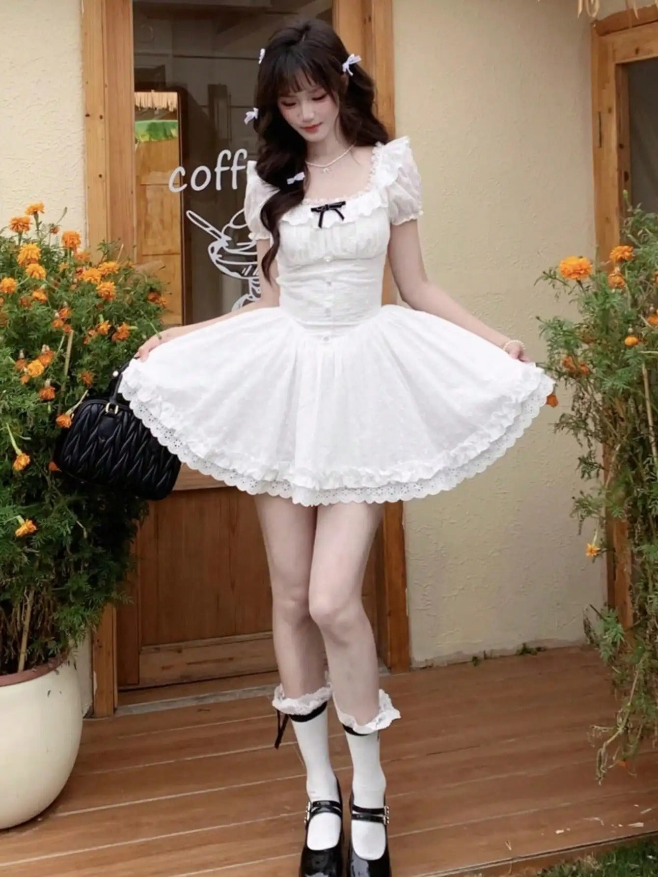 White lolita mini dress with kawaii cutecore vibes, DDLG ABDL aesthetic with frilly black ribbon detail