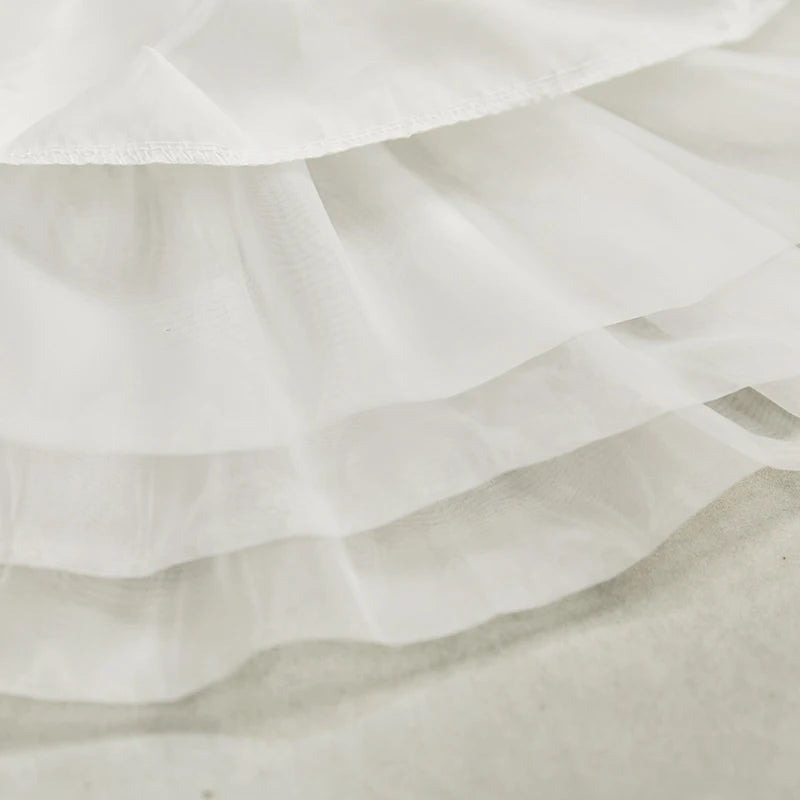 Close-up of white petticoat fabric showing soft breathable material texture