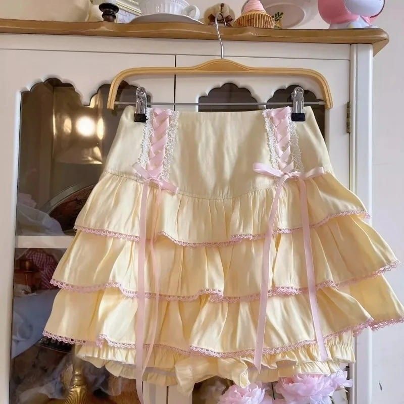 Yellow Fairycore Lolita High Waist Ribbon Skirt with pink ribbon accents and frilly kawaii details