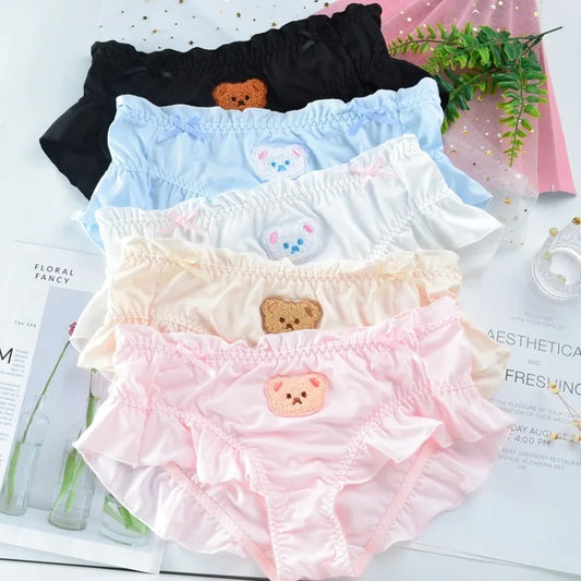 Collection of adorable teddy ruffle panties in solid colors black, blue, white, yellow, and pink with soft breathable fabric