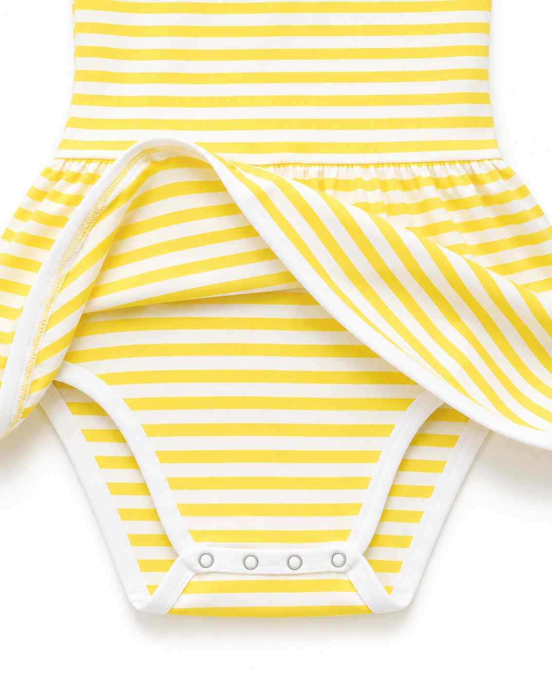 Close up of snap closure at the base of the Honeybee Yellow bee striped onesie dress