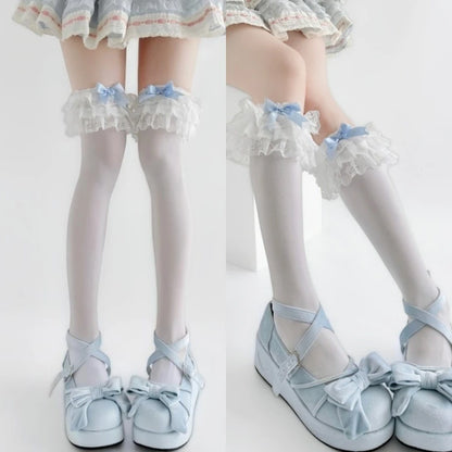 Close up of ruffle and bow detail on baby blue doll stockings