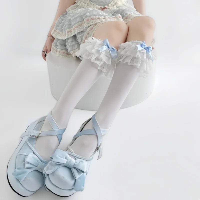 Soft white sheer fabric texture detail on baby blue doll stockings