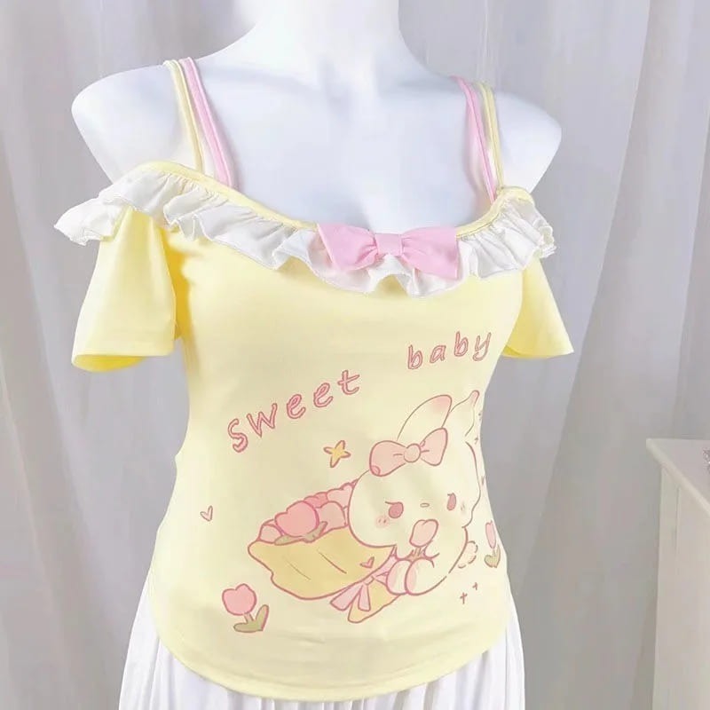 Baby doll cami top with bow detail, perfect for layering and kawaii streetwear