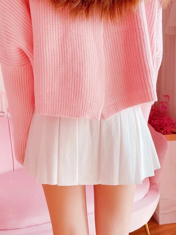 Model wearing Baby Doll Pink Bow pleated skort, back view, dollcore style