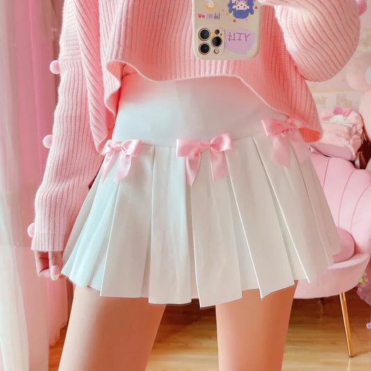 Model wearing Baby Doll Pink Bow pleated skort with satin bows, DDLGirl style
