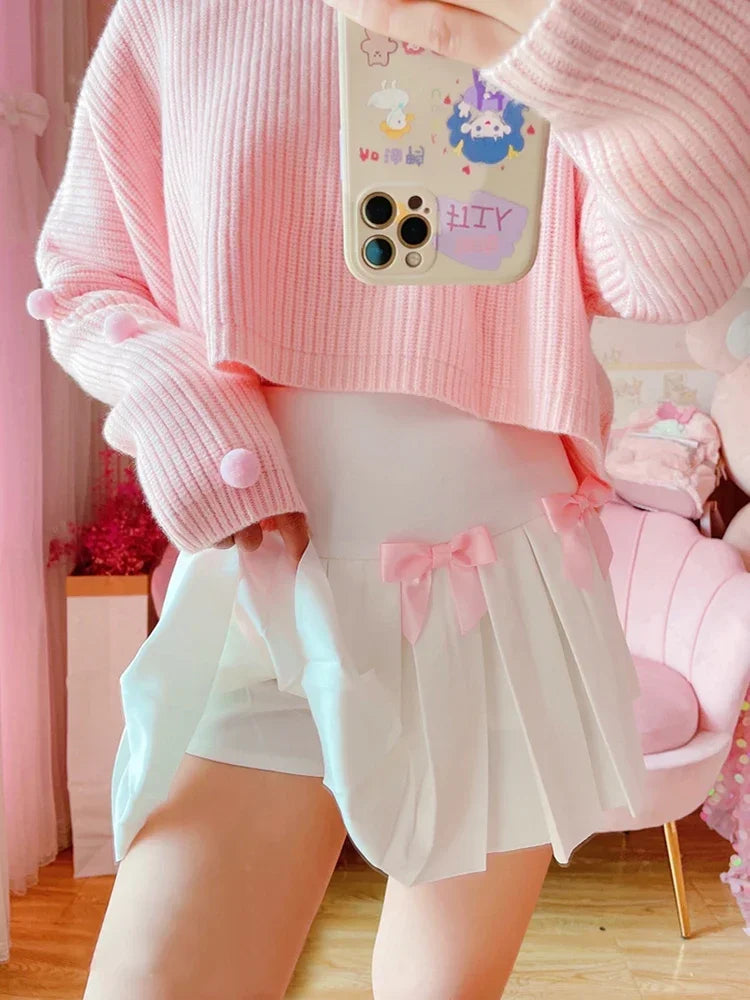 Model wearing Baby Doll Pink Bow pleated skort, side angle, DDLGirl style