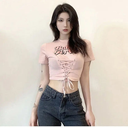 Babygirl Glow pink crop top with lace-up front and babygirl aesthetic details