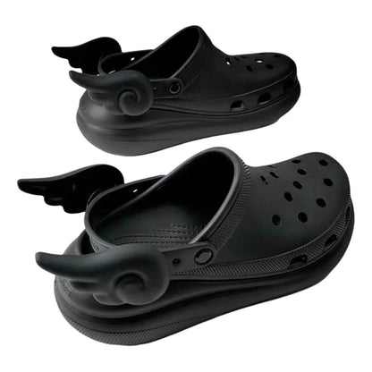 Black angel wing shoe charms styled on Crocs – pastel goth shoe fashion