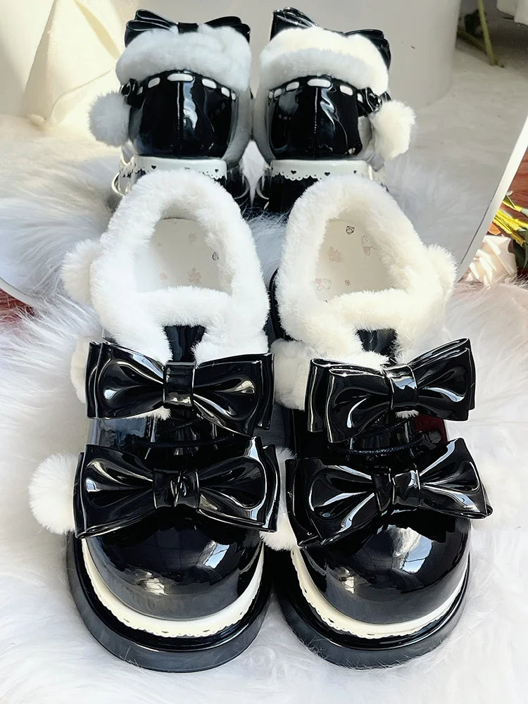 Black platform baby shoes with playful pom poms and ribbon bows, ideal for DDLG and cutecore aesthetics