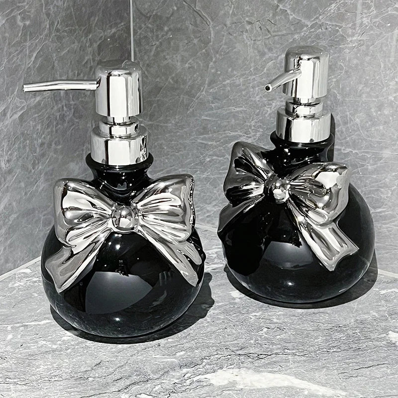 Black and silver princess bow refillable soap dispenser, kawaii cutecore bathroom accessory with chic vibes.