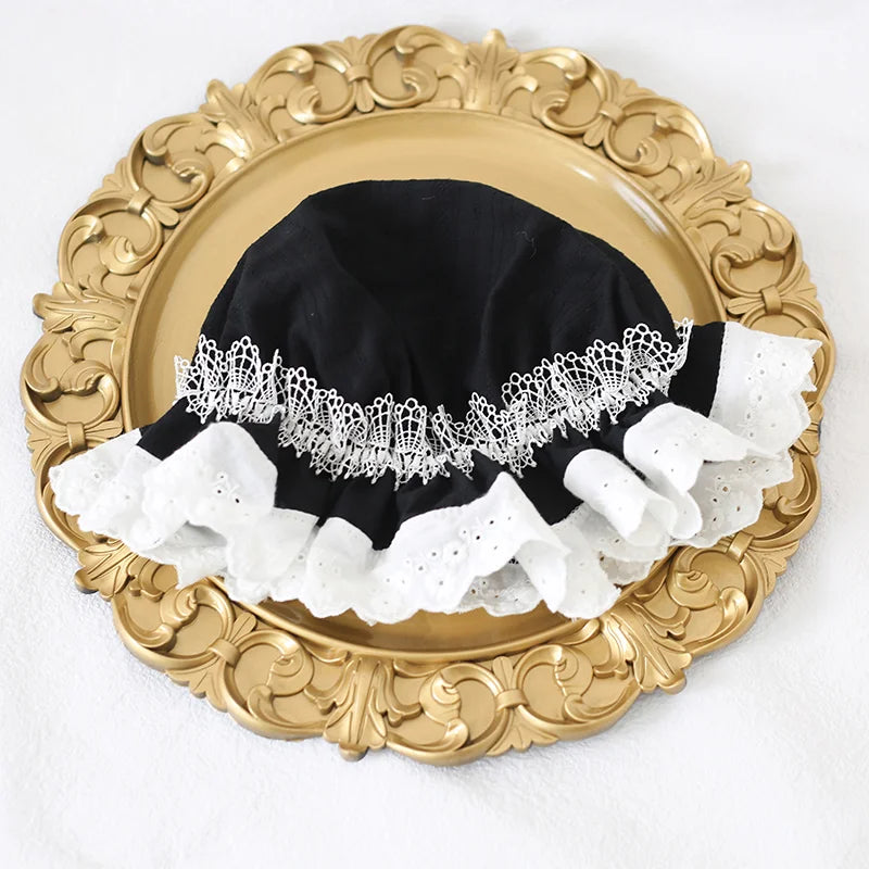 Duo of black and white lace bonnets with Victorian flair
