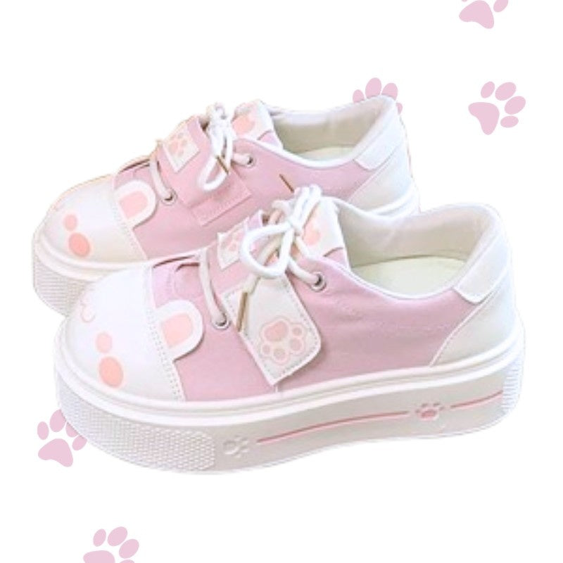 Blushing kitten paws kawaii sneakers in pastel pink with adorable paw prints and cute soft vibes