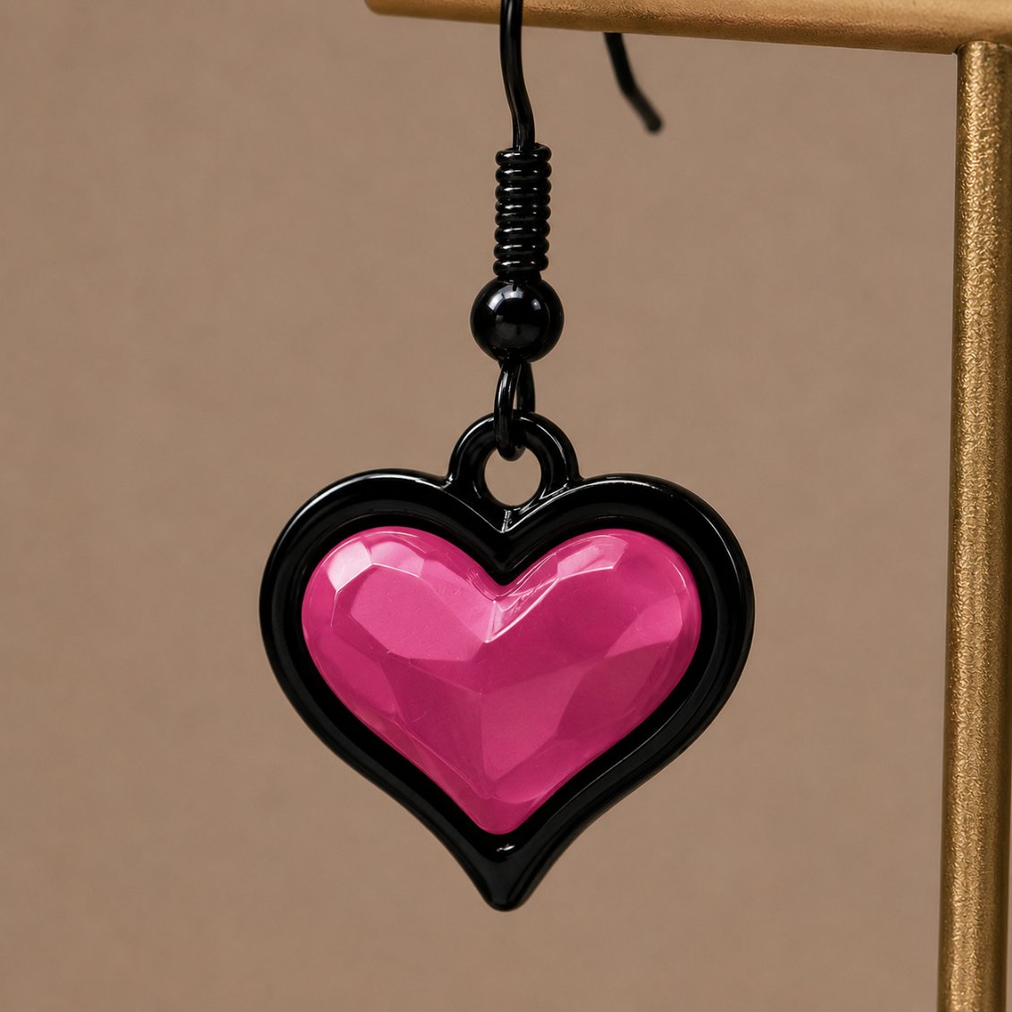 Faceted heart pendant detail on bubblegum goth sweetheart earrings